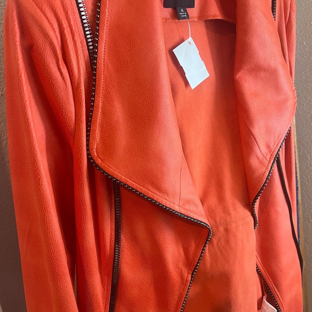 Cute spring color! Long coral jacket, length just below knee. Never worn.